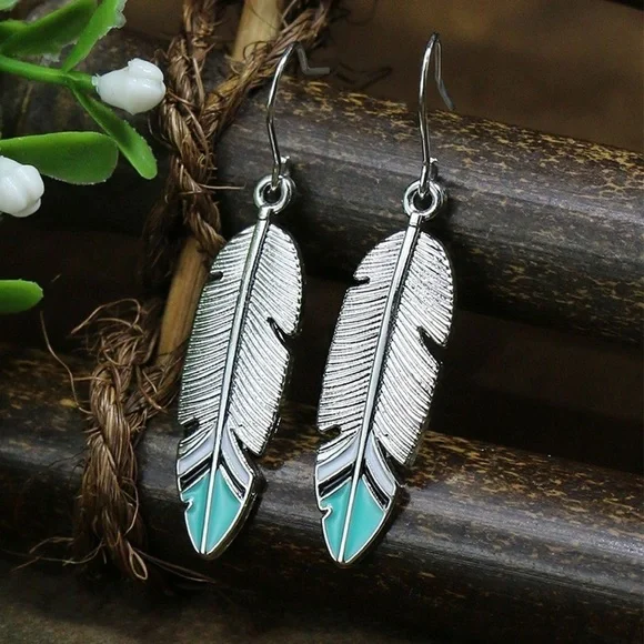 Boho Festival silver tone feather earrings with turquoise blue tips - Picture 1 of 6